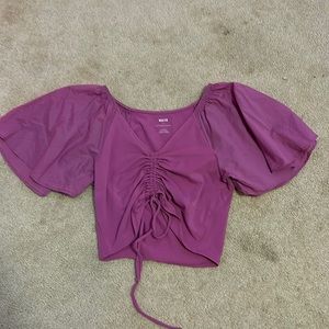XS magenta cropped blouse from anthropologie. scrunches are adjustable.